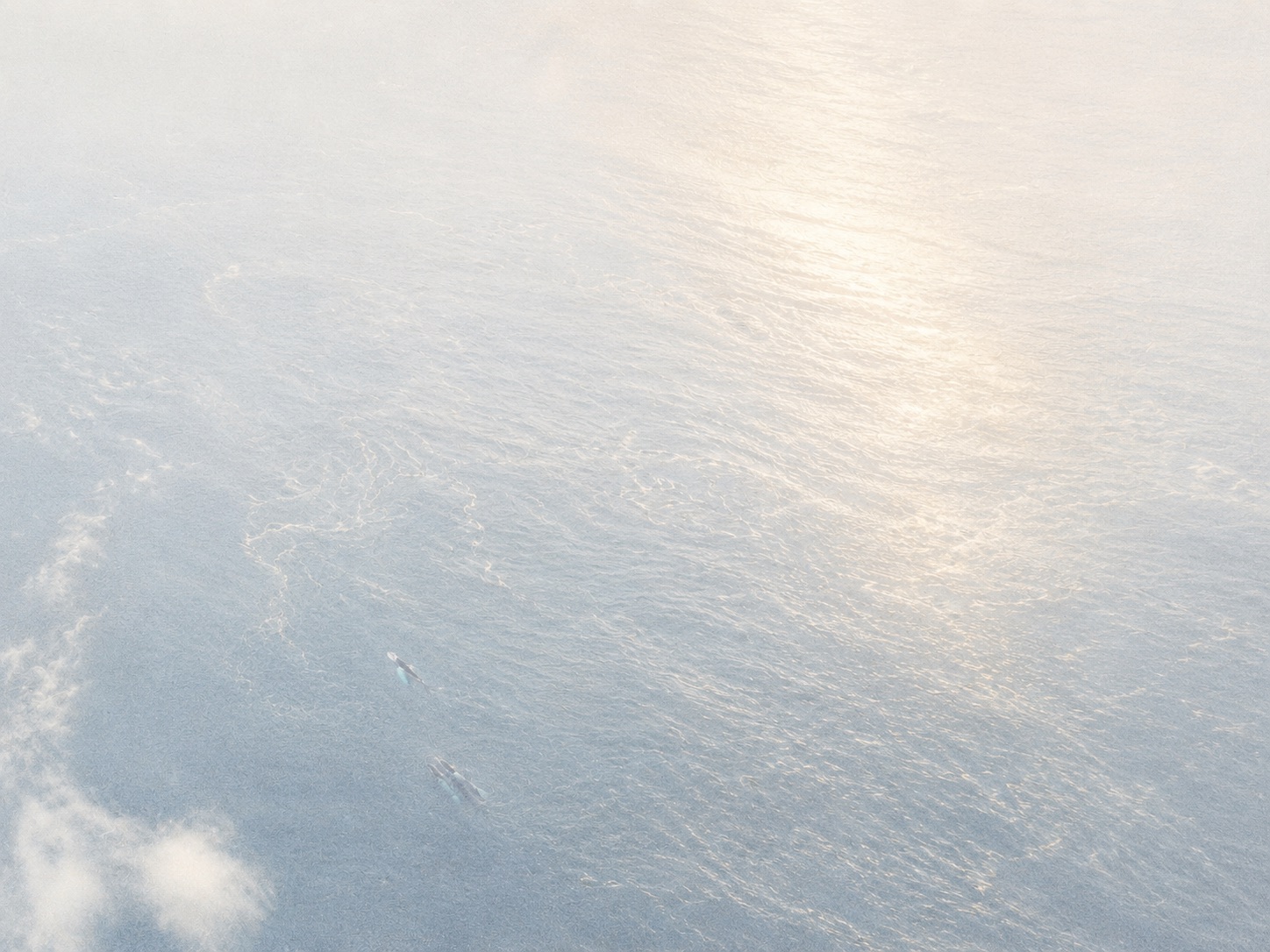 Aerial view of turquoise ocean currents near the shore
